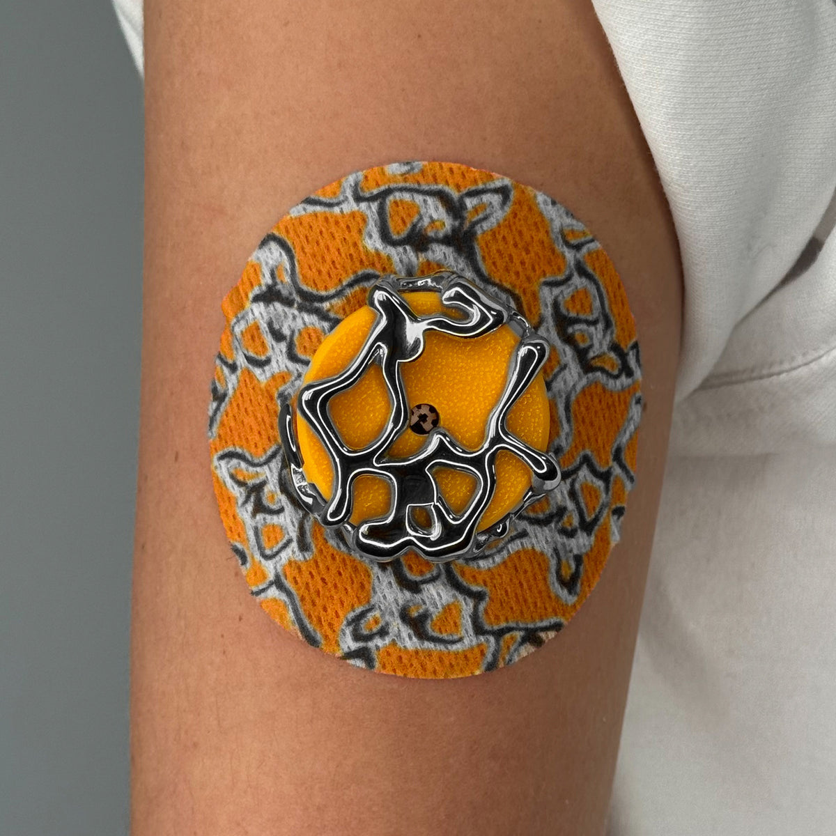 Yellow Venom CGM patch with a silver finish for Libre 2