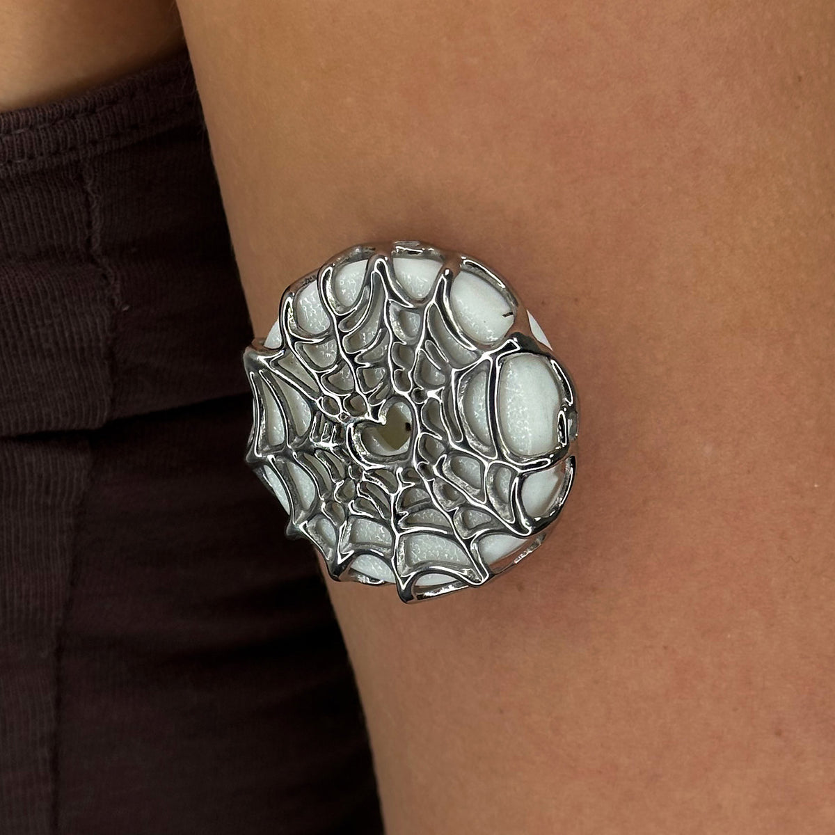Silver Webbed Armour for Simplera, worn on the arm