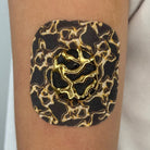 Grey Venom CGM patch with a gold finish for Dexcom G7