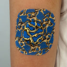 Blue Venom CGM patch with a gold finish for Dexcom G7