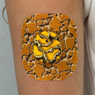 Yellow Venom CGM patch with a gold finish for Dexcom G7