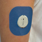 Blue Everyday CGM patch for Dexcom G7, worn on the body