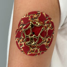 Red Venom CGM patch with a gold finish for Libre 2