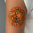 Orange Venom CGM patch with a gold finish for Libre 2